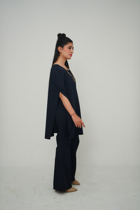 Cape with chain detail — alternate view