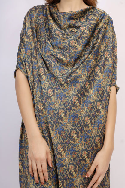 Floral patterned dress with a draped design on a plain background