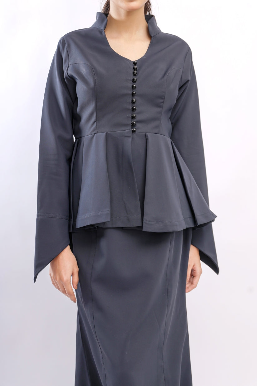 Dark gray peplum top and long skirt set on a white background