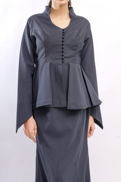 Dark gray peplum top and long skirt set on a white background