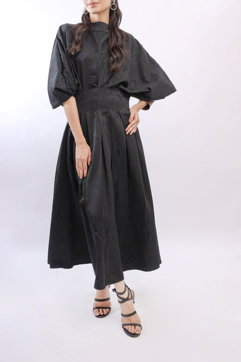 Person wearing a black dress with a white background — Ecko Apparel