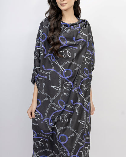 Woman wearing a black dress with purple chain pattern on a white background