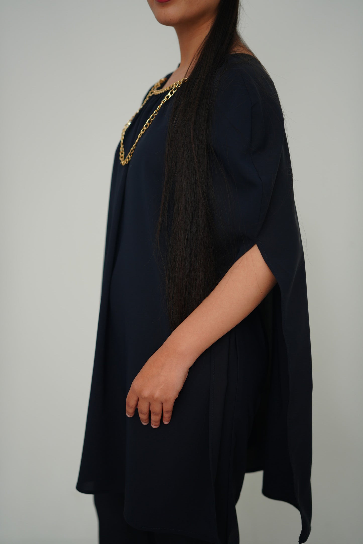 Cape with chain detail