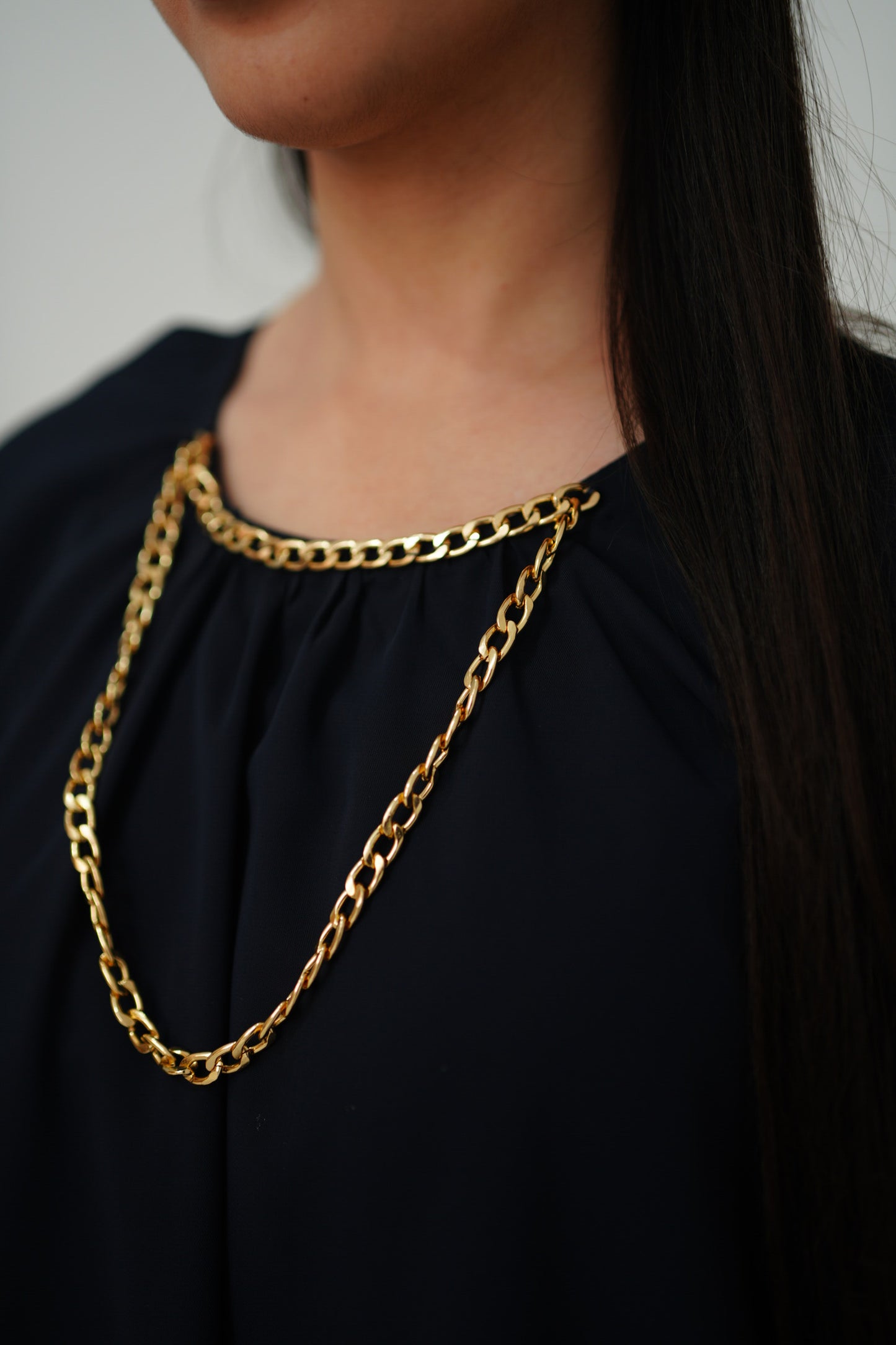 Cape with chain detail